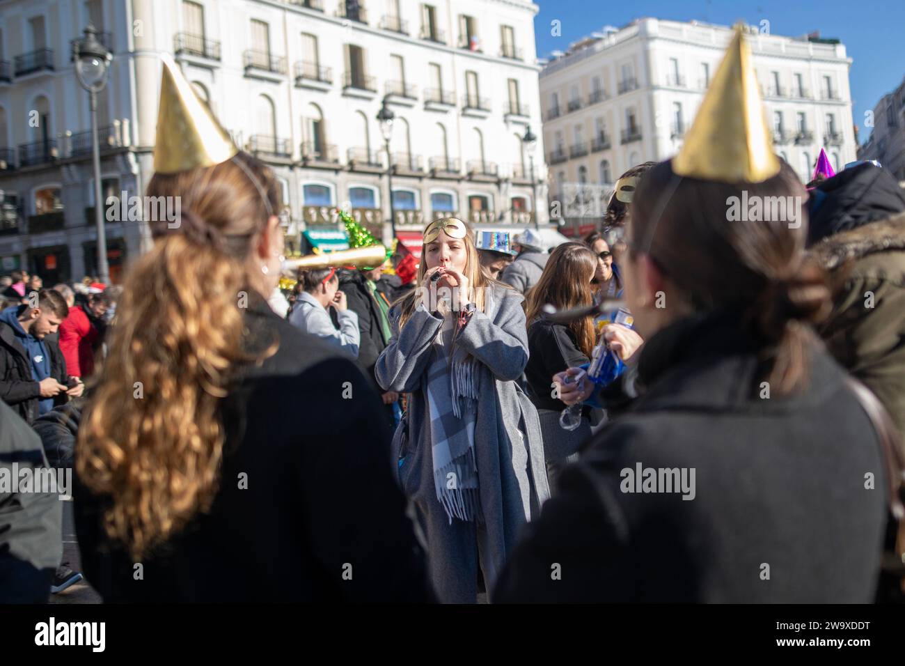 A group of friends celebrate the arrival of a new year in the Puerta ...