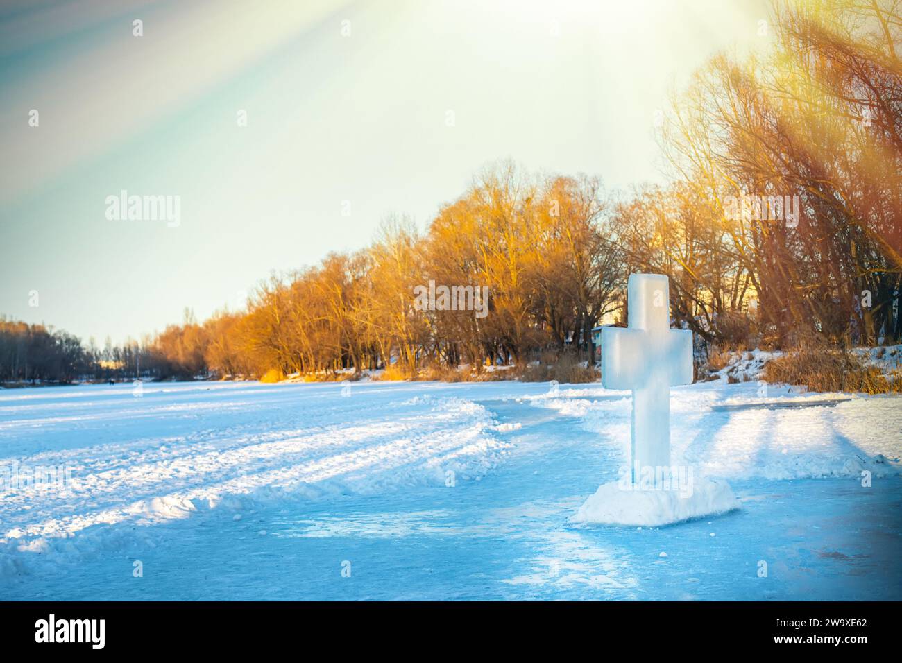 Holidays of Orthodox baptism. Ice cross hole and a cross of ice in Ukraine Stock Photo