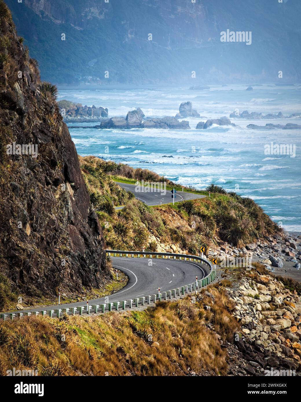 The West Coast drive hugs the coastline of the South Island of New Zealand. Stock Photo