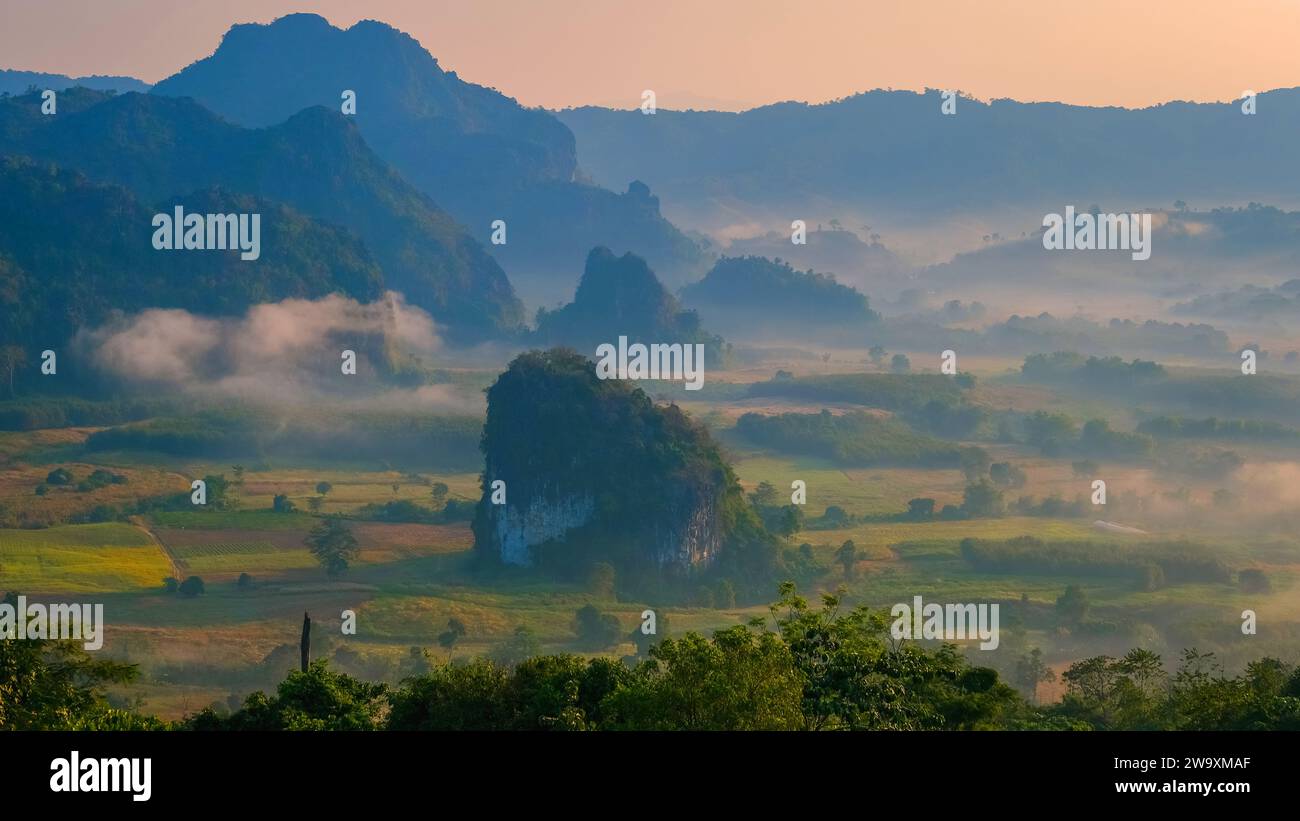 Phu Langka Mountains Northern Thailand, Mountain View of Phu Langka National Park at Phayao Province. A sea of fog in a valley moving around a small rock mountain Pha Chang Noi route 1148 Thailand Stock Photo