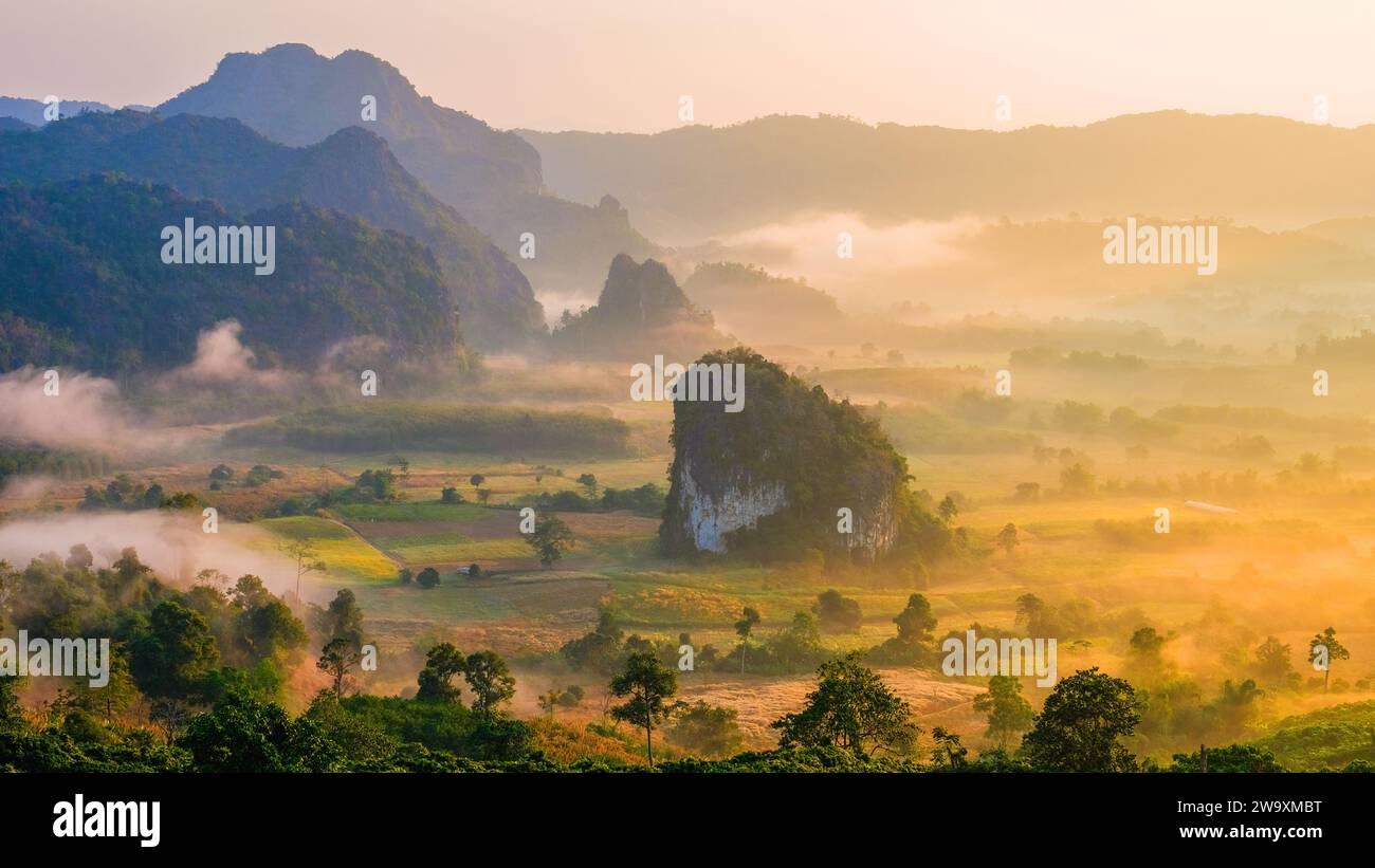 Phu Langka Mountains Northern Thailand Phayao Province. A sea of fog in a valley moving around a small rock mountain Pha Chang Noi route 1148 Thailand Stock Photo