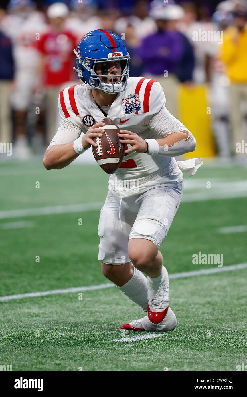 Atlanta, Georgia. 30th Dec, 2023. Jaxson Dart (2) of Ole Miss looks for a receiver during the Chick-fil-A Peach Bowl featuring the #11 Ole Miss Rebels and the #10 Penn State Nittany Lions, played at Mercedes-Benz Stadium in Atlanta, Georgia. Ole Miss defeats Penn State, 38-25. Cecil Copeland/CSM(Credit Image: © Cecil Copeland/Cal Sport Media). Credit: csm/Alamy Live News Stock Photo