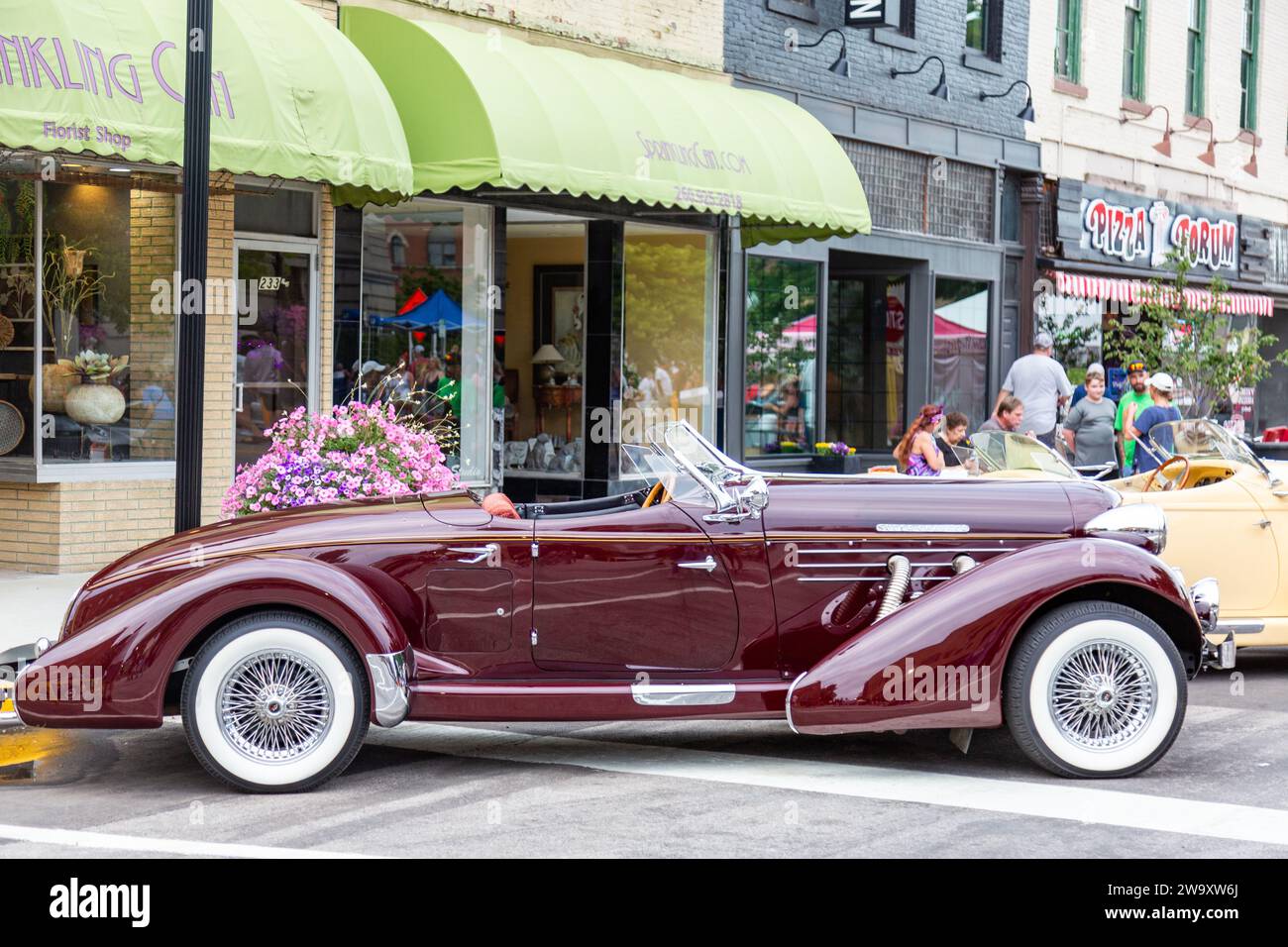 This maroon Auburn convertible replica is on display as part of the 2022 ACD Festival car show in downtown Auburn, Indiana, USA. Stock Photo