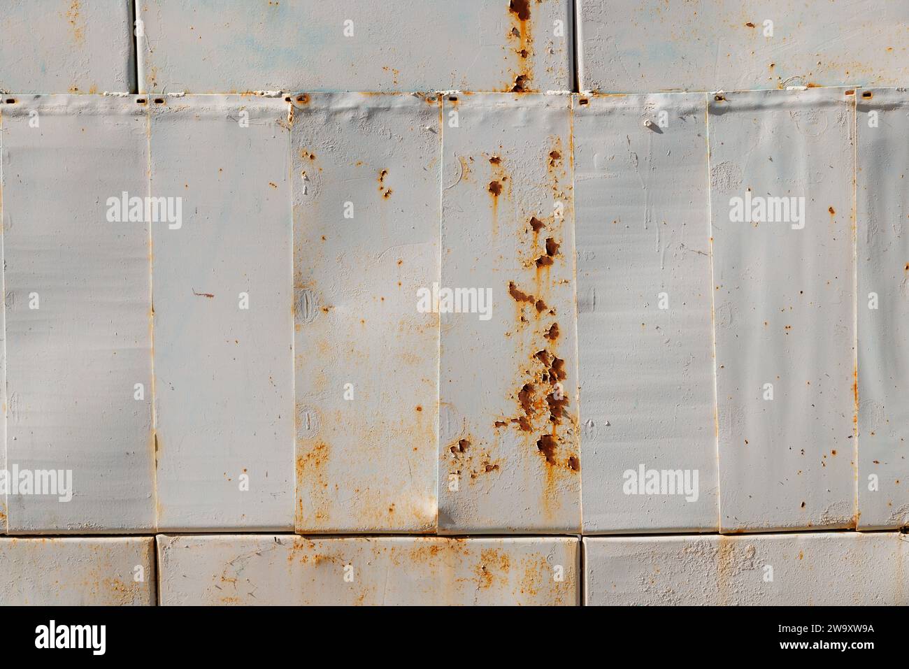 steel sheets patchwork painted gray with rust spots closeup full-frame background and texture Stock Photo