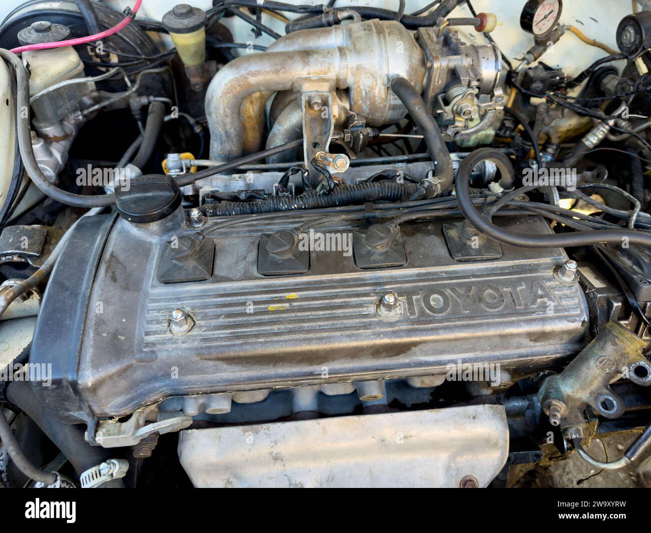 Toyota old model four cylinder car engine closeup 04 December 2023