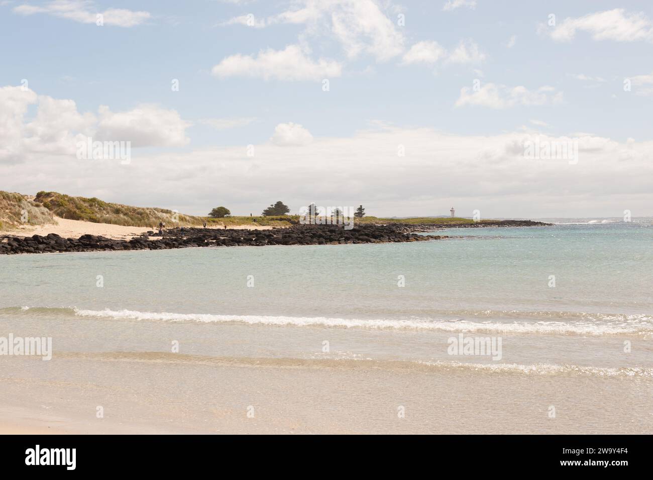 Scenic landscape including a far off viw of the Griffiths Island Port Fairy Lighthouse Stock Photo