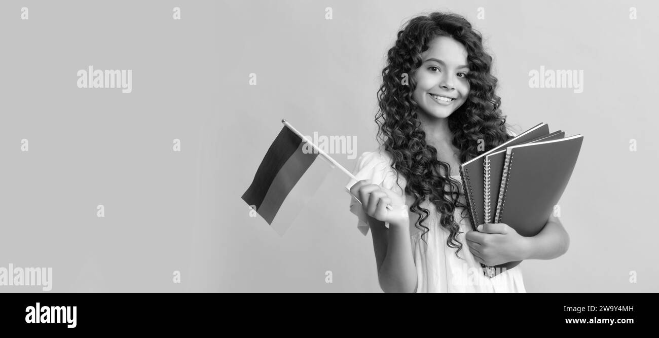 german language. child hold flag. back to school. teen girl study in