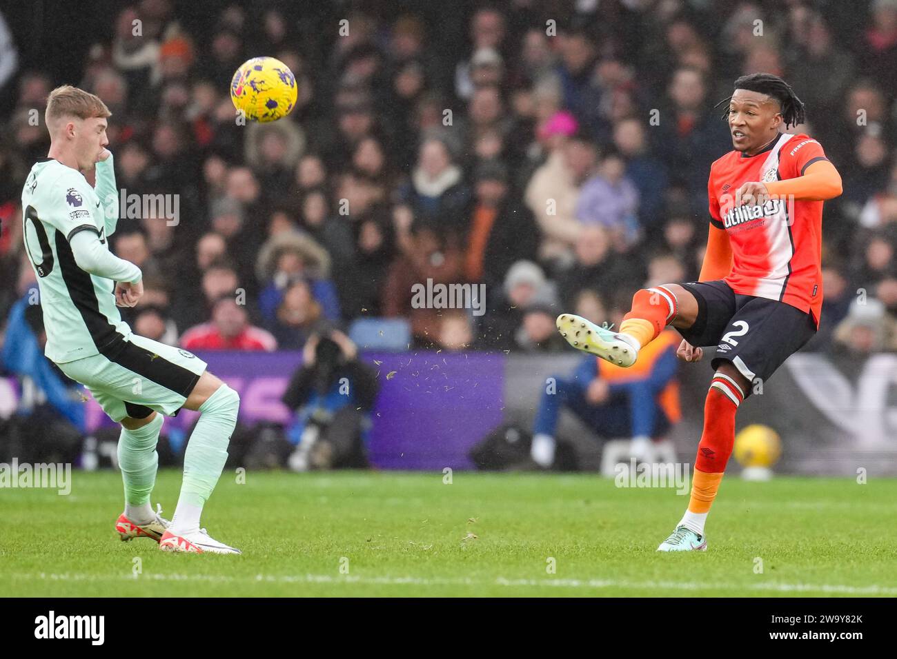 Luton, UK. 30th Dec, 2023. Cole Palmer (20) of Chelsea and Gabe Osho (2) of Luton Town during the Premier League match between Luton Town and Chelsea at Kenilworth Road, Luton, England on 30 December 2023. Photo by David Horn. Credit: PRiME Media Images/Alamy Live News Stock Photo