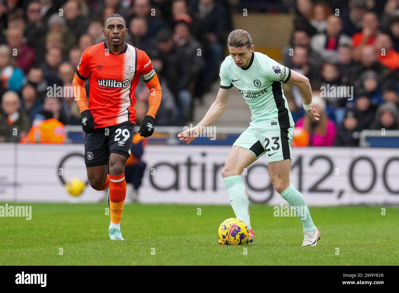 Luton, UK. 30th Dec, 2023. Amari'i Bell (29) of Luton Town and Conor Gallagher (23) of Chelsea during the Premier League match between Luton Town and Chelsea at Kenilworth Road, Luton, England on 30 December 2023. Photo by David Horn. Credit: PRiME Media Images/Alamy Live News Stock Photo