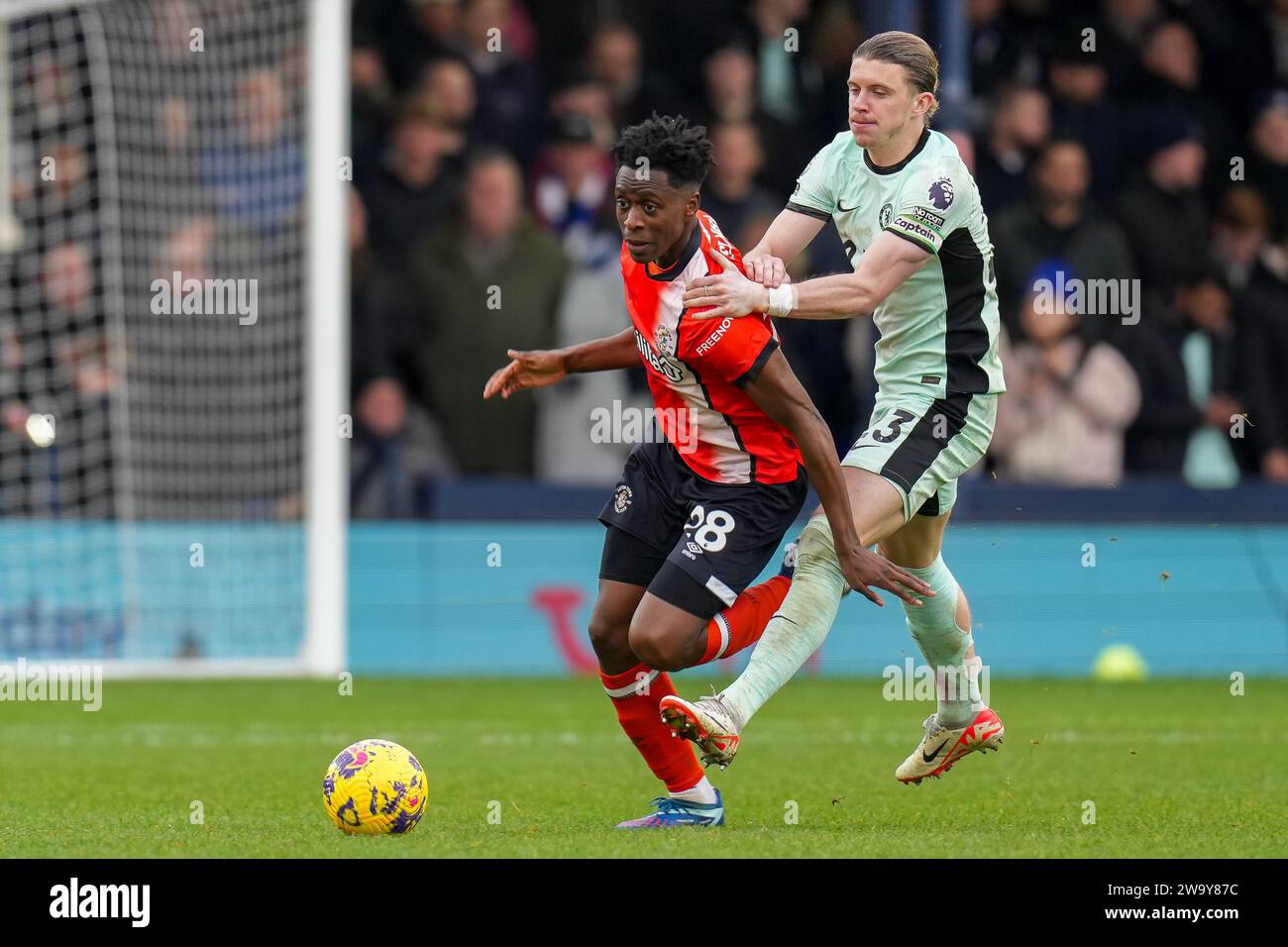 Luton, UK. 30th Dec, 2023. Albert Sambi Lokonga (28) of Luton Town is fouled by Conor Gallagher (23) of Chelsea during the Premier League match between Luton Town and Chelsea at Kenilworth Road, Luton, England on 30 December 2023. Photo by David Horn. Credit: PRiME Media Images/Alamy Live News Stock Photo