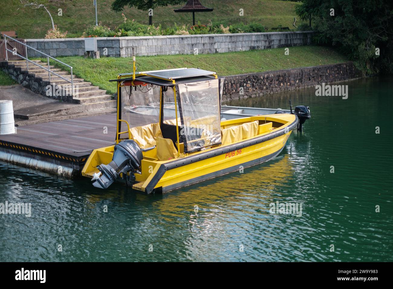 Singapore - September 7 2023: Yellow Patrol Boat at Platform Stock Photo
