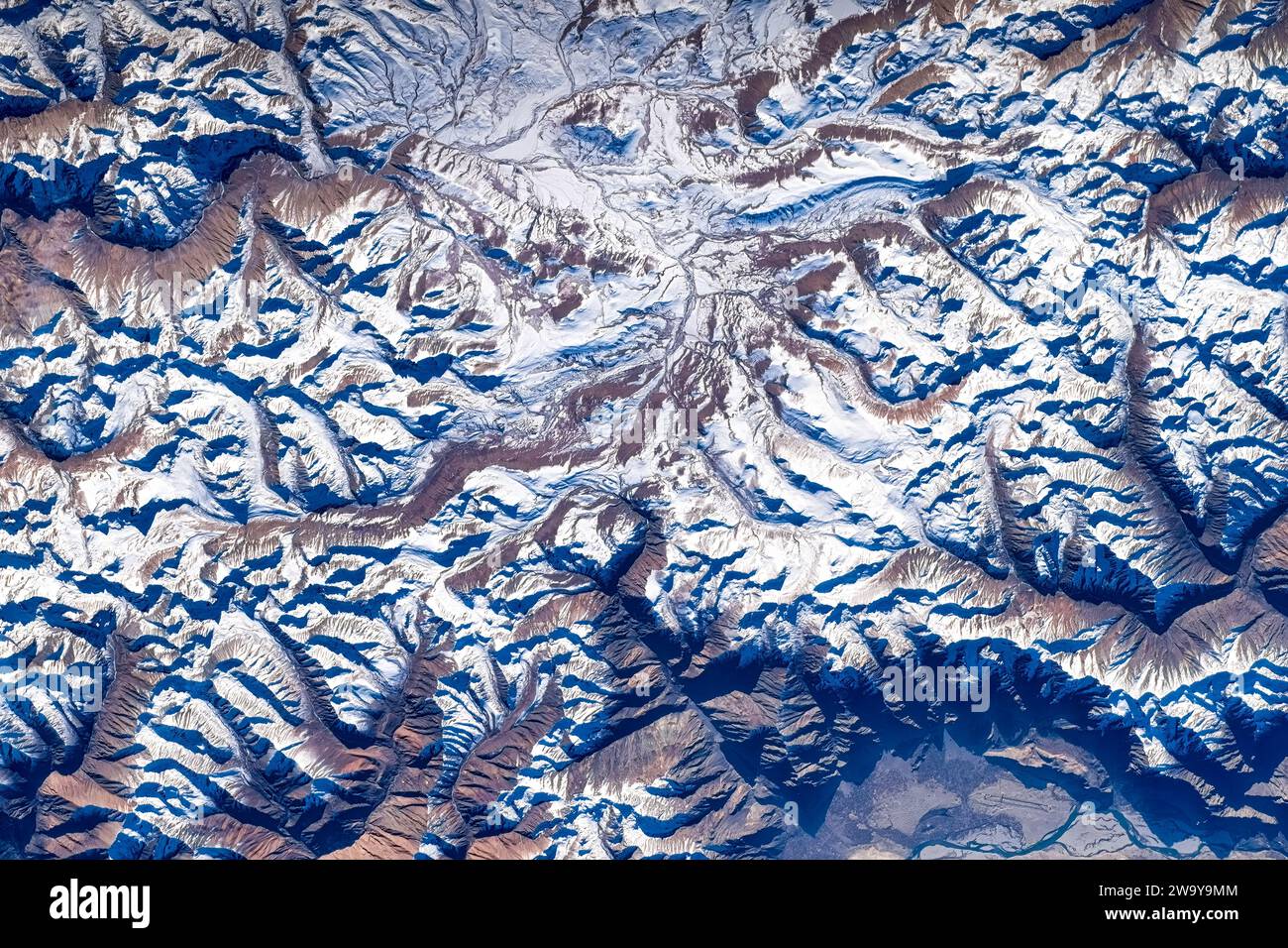 Snow Mountain Land in Afganistan. Digital enhancement of a NASA image. Stock Photo