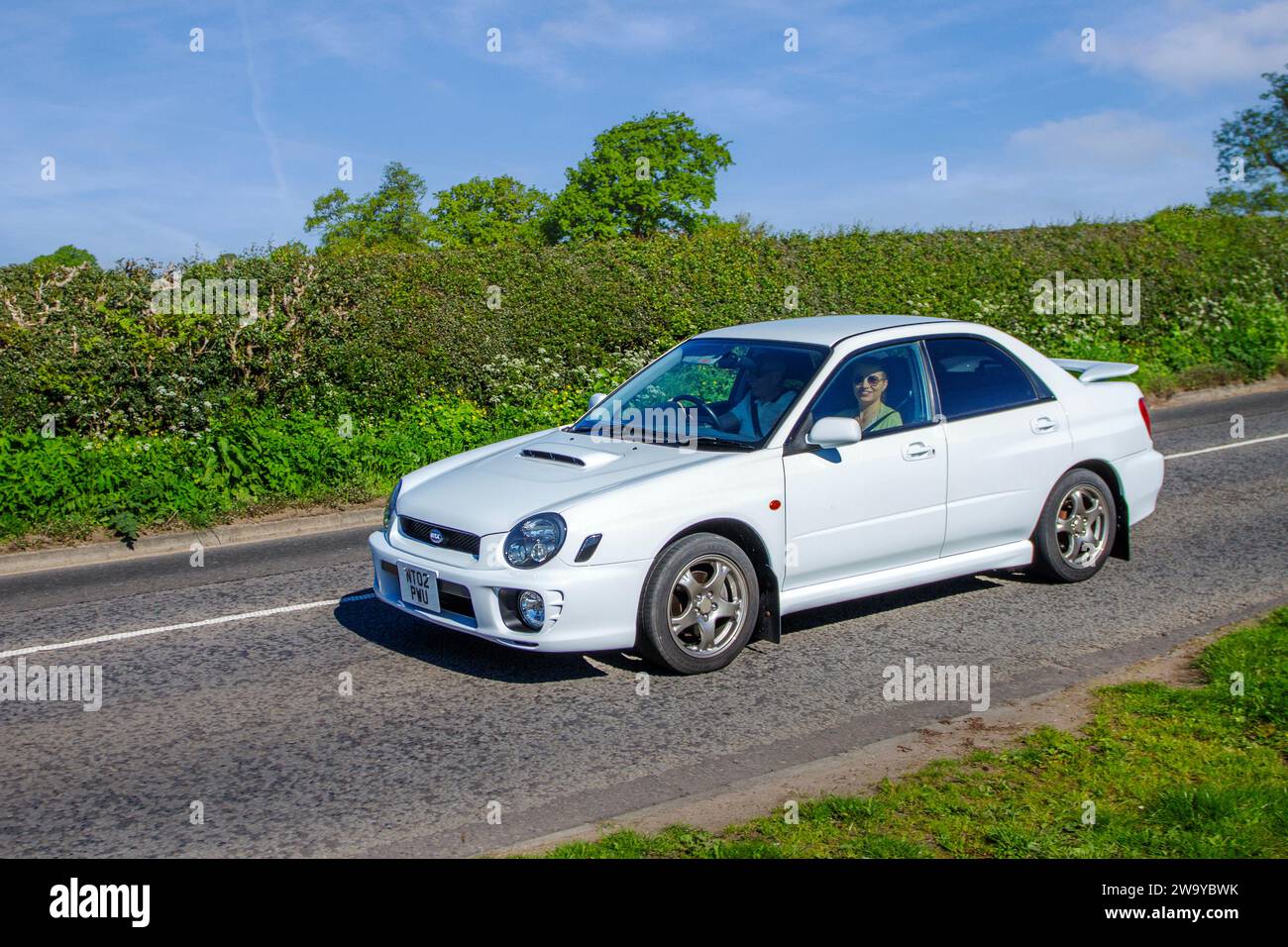 2002 White Subaru WRX 1990 cc petrol; Vintage restored classic specialist motors vehicle restoration, automobile collectors, yesteryear motoring enthusiasts and historic veteran cars travelling in Cheshire, UK Stock Photo