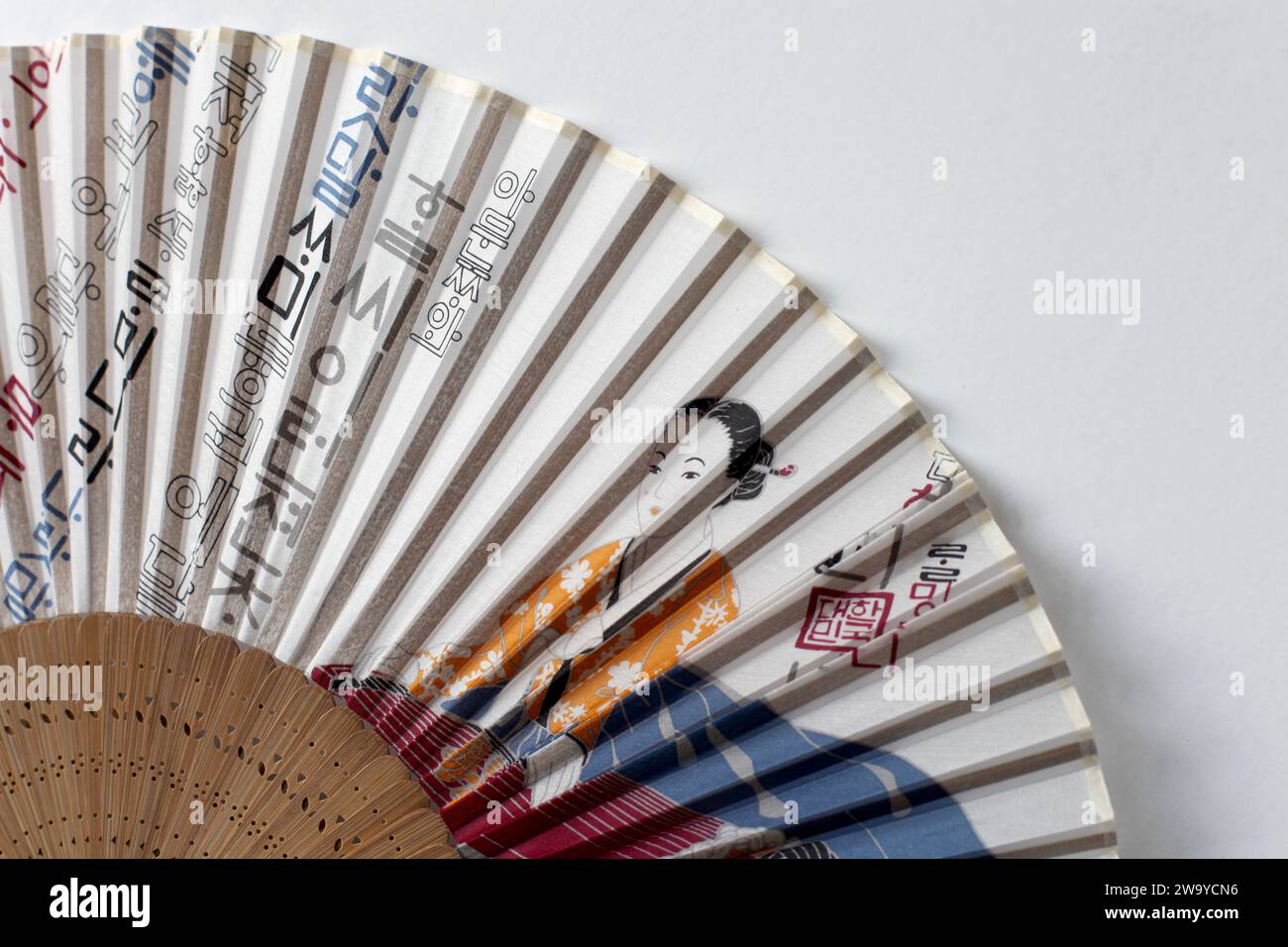A buchae or traditional Korean fan which is often highly decorated. Stock Photo