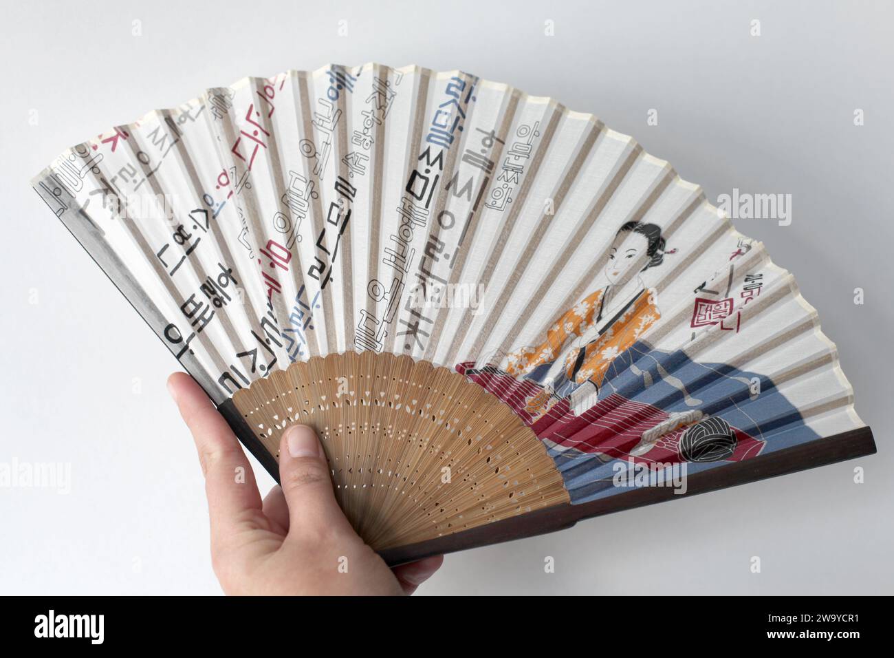A buchae or traditional Korean fan which is often highly decorated. Stock Photo