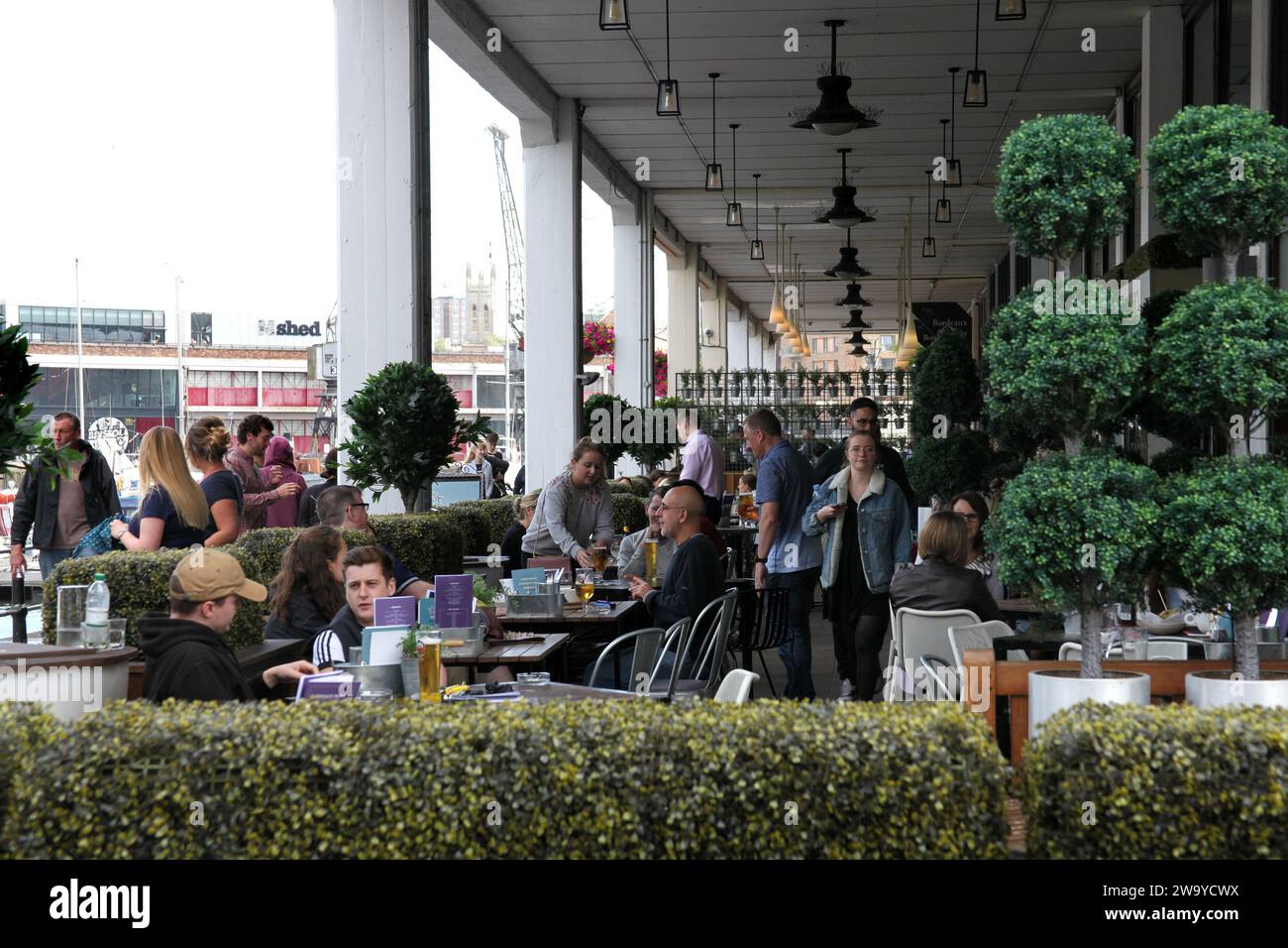 Bristol, Somerset, UK 06 16 2018 People socializing together at a riverside bar in Bristol Stock Photo
