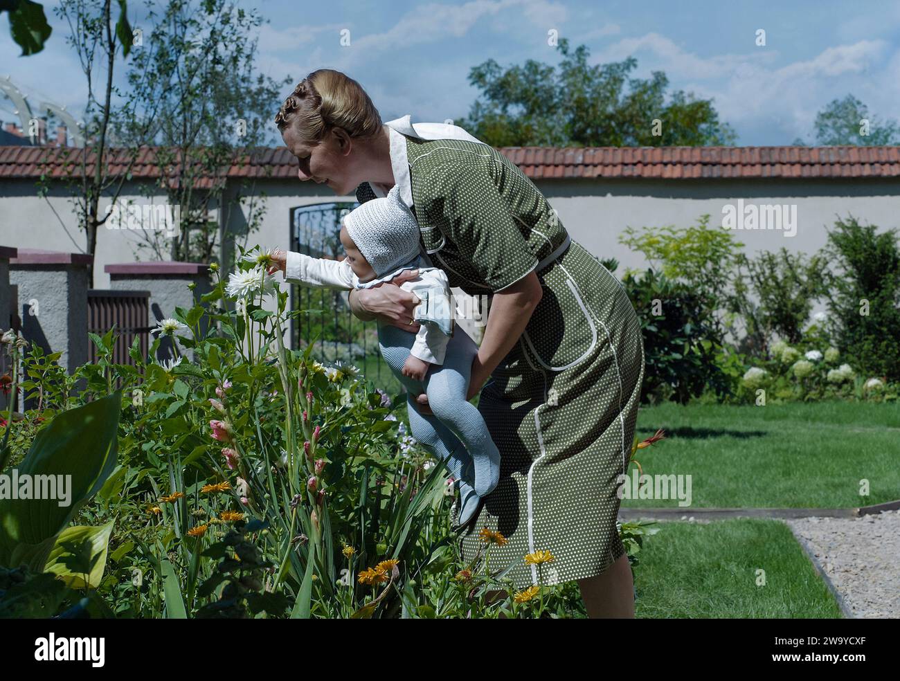 The Zone of Interest (2023) directed by Jonathan Glazer and starring Sandra Hüller as Hedwig Höss, wife of the commandant of Auschwitz, Rudolf Höss, who strive to build a dream life for their family in a house and garden next to the camp. Big screen adaptation of Martin Amis' novel.  Publicity photograph ***EDITORIAL USE ONLY***. Credit: BFA / A24 Stock Photo