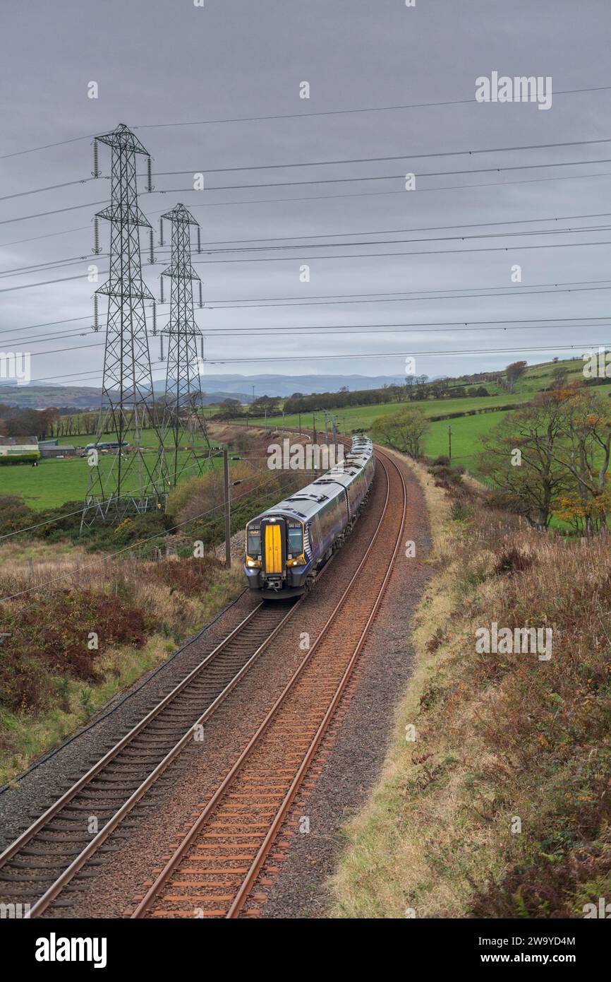 Scotrail class 380 electric trains passing the Ayrshire countryside near West Kilbride, Scotland, UK Stock Photo