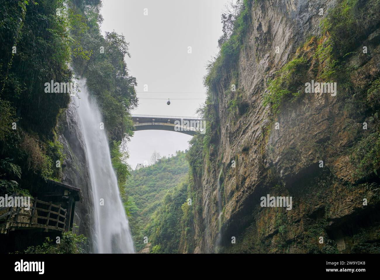 Lush vegetation and waterfalls. Bridges across canyons, cable cars in the sky. Enshi Yunlong Gorge is a 'karst terrain' in the field of geology. Hubei Stock Photo