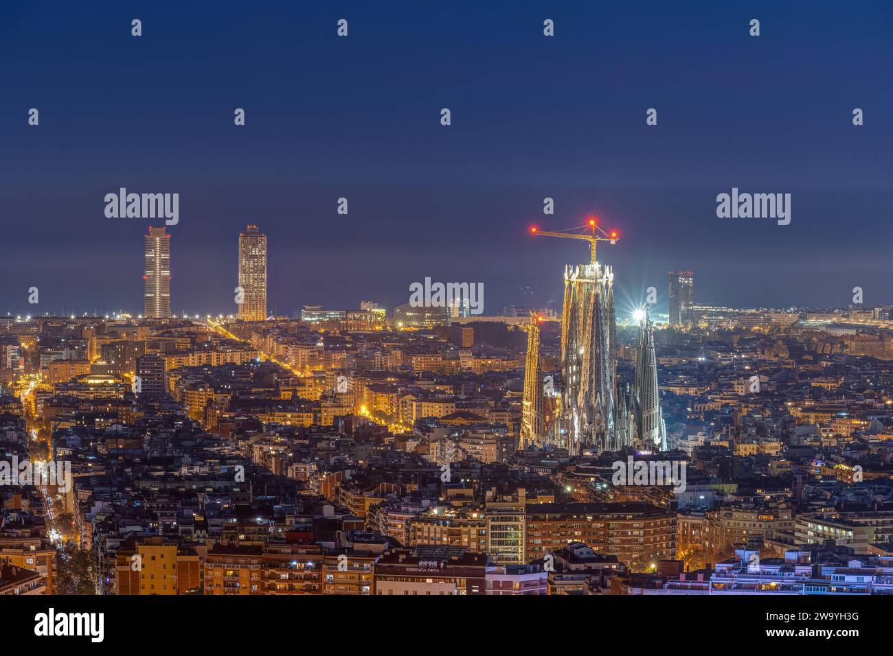 The skyline of downtown Barcelona with the Sagrada Familia at night Stock Photo