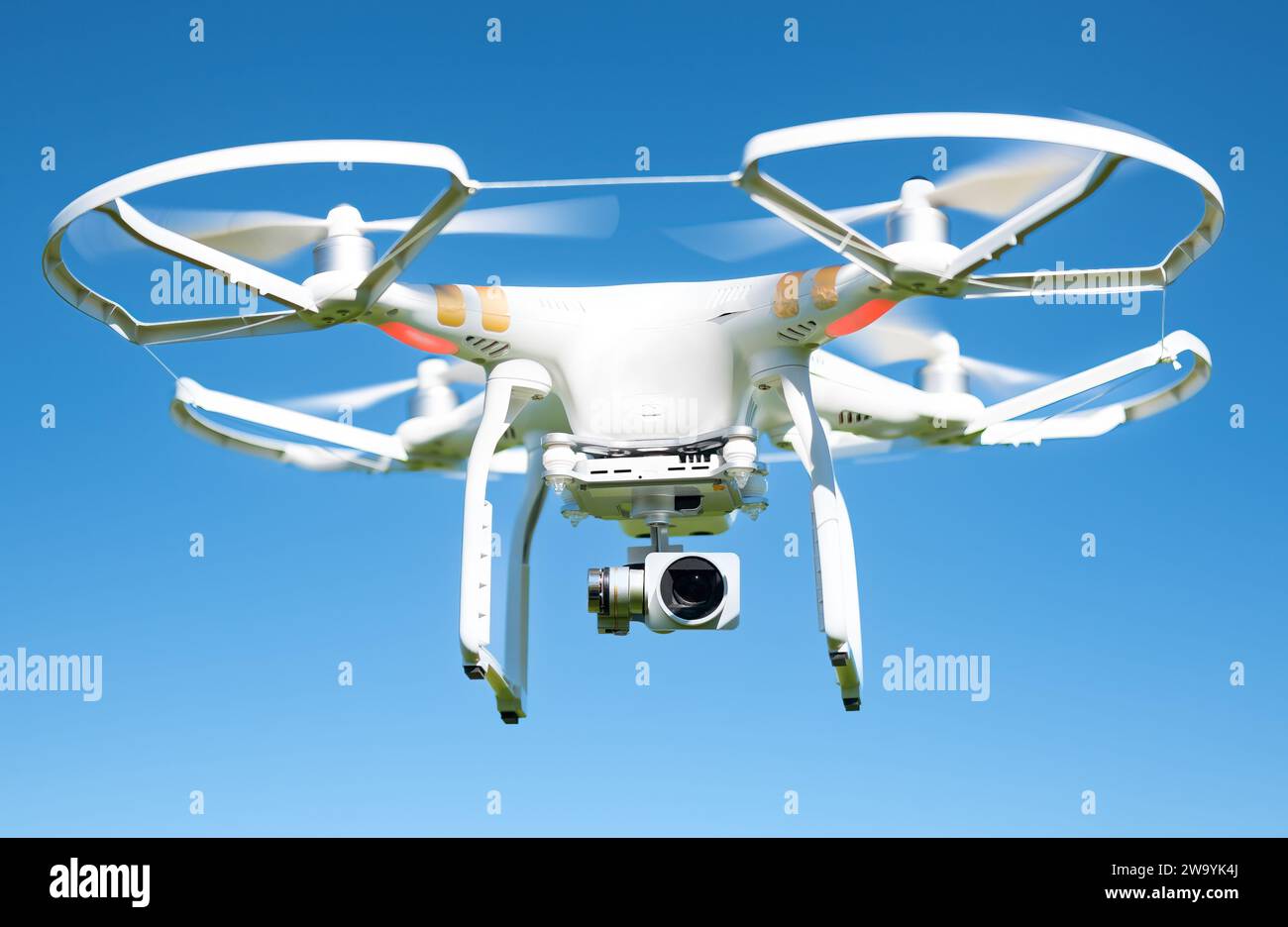 Toronto, Ontario, Canada-January 6, 2020: White drone flying high in the air, these unmanned aerial vehicles are intended for recreational and commerc Stock Photo