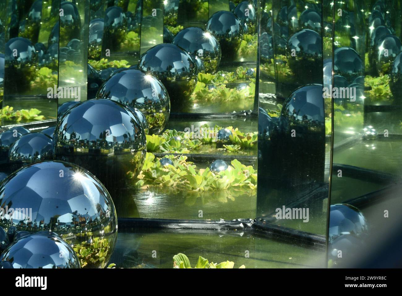 Art in The Bristol Botanical Gardens a multitude of reflections from cleverly placed mirrors and many faceted mirror balls in the summer sunshine. Bri Stock Photo