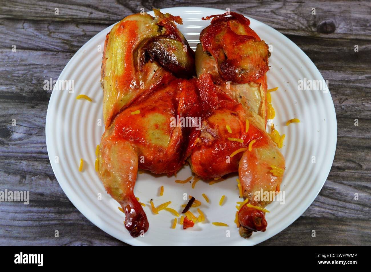 Gulf cuisine of Mandi cooked chicken, a whole chicken made in a Mandi