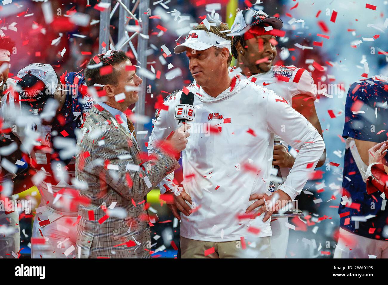 December 30, 2023: Ole Miss head coach, Lane Kiffin, hoists the Chick-fil-A Peach Bowl winners' trophy at Mercedes-Benz Stadium in Atlanta, Georgia. Ole Miss defeats Penn State, 38-25. Cecil Copeland/CSM Stock Photo