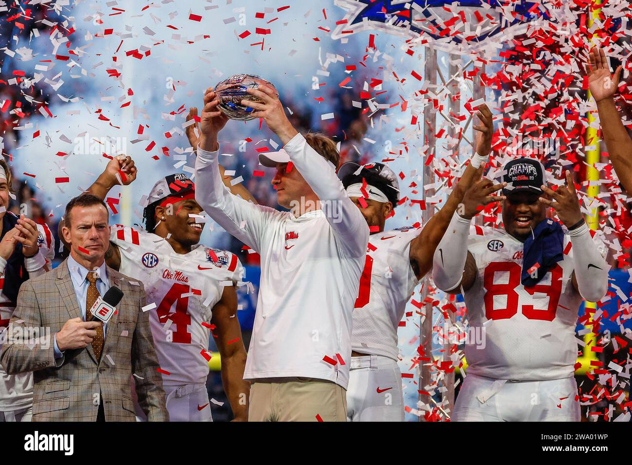 December 30, 2023: Ole Miss head coach, Lane Kiffin, hoists the Chick-fil-A Peach Bowl winners' trophy at Mercedes-Benz Stadium in Atlanta, Georgia. Ole Miss defeats Penn State, 38-25. Cecil Copeland/CSM Stock Photo