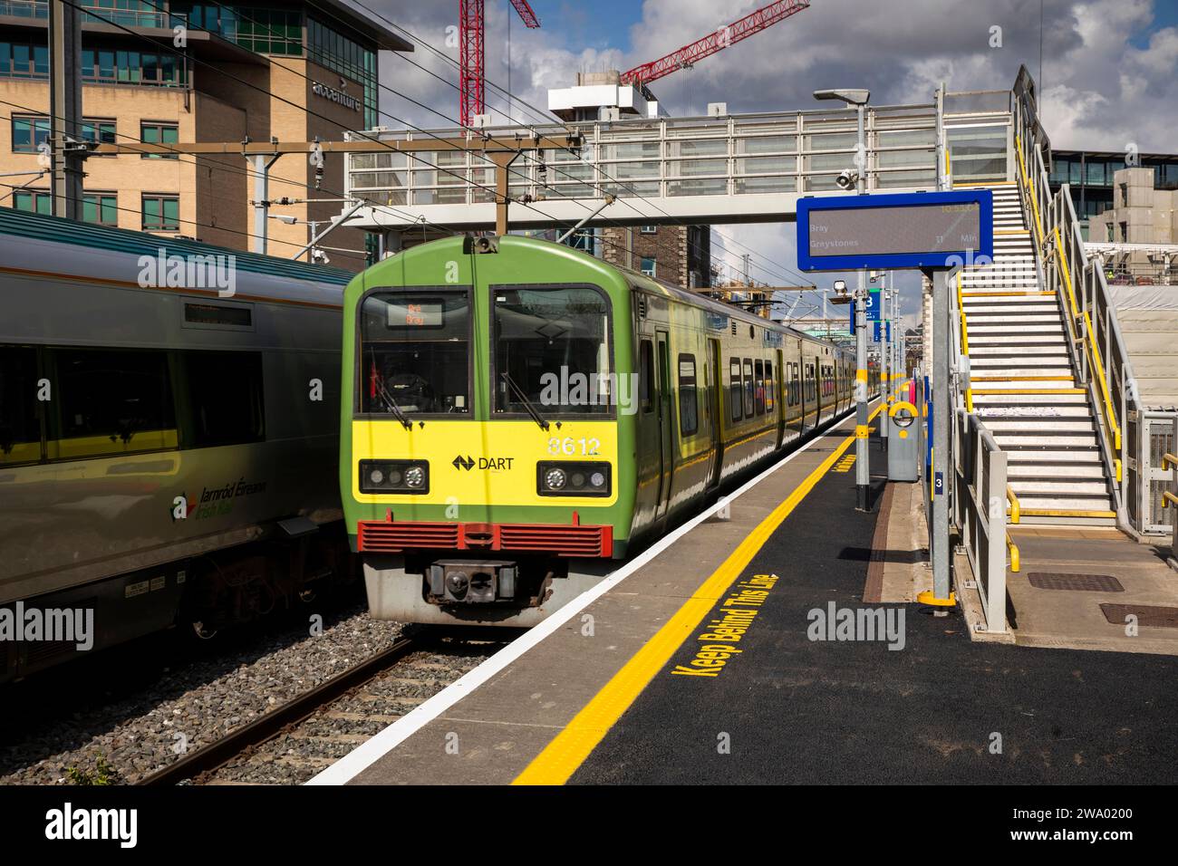 Ireland, Dublin, DART Rapid Transport railway train aproaching Grand Canal Basin station Stock Photo