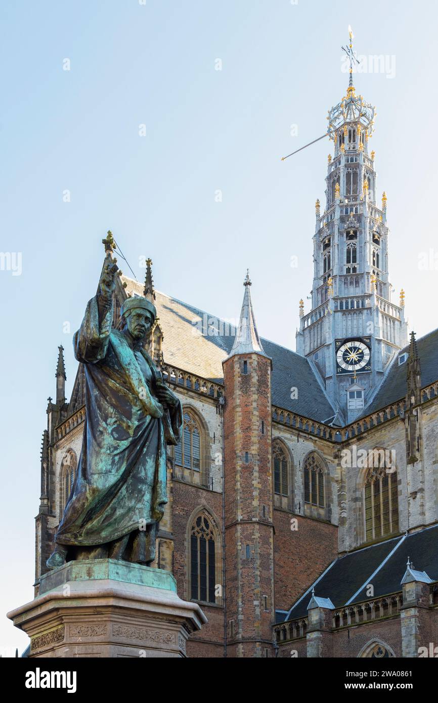 Statue of  with in the background the Grote Kerk - St. Bavokerk, in the city of Haarlem. Stock Photo