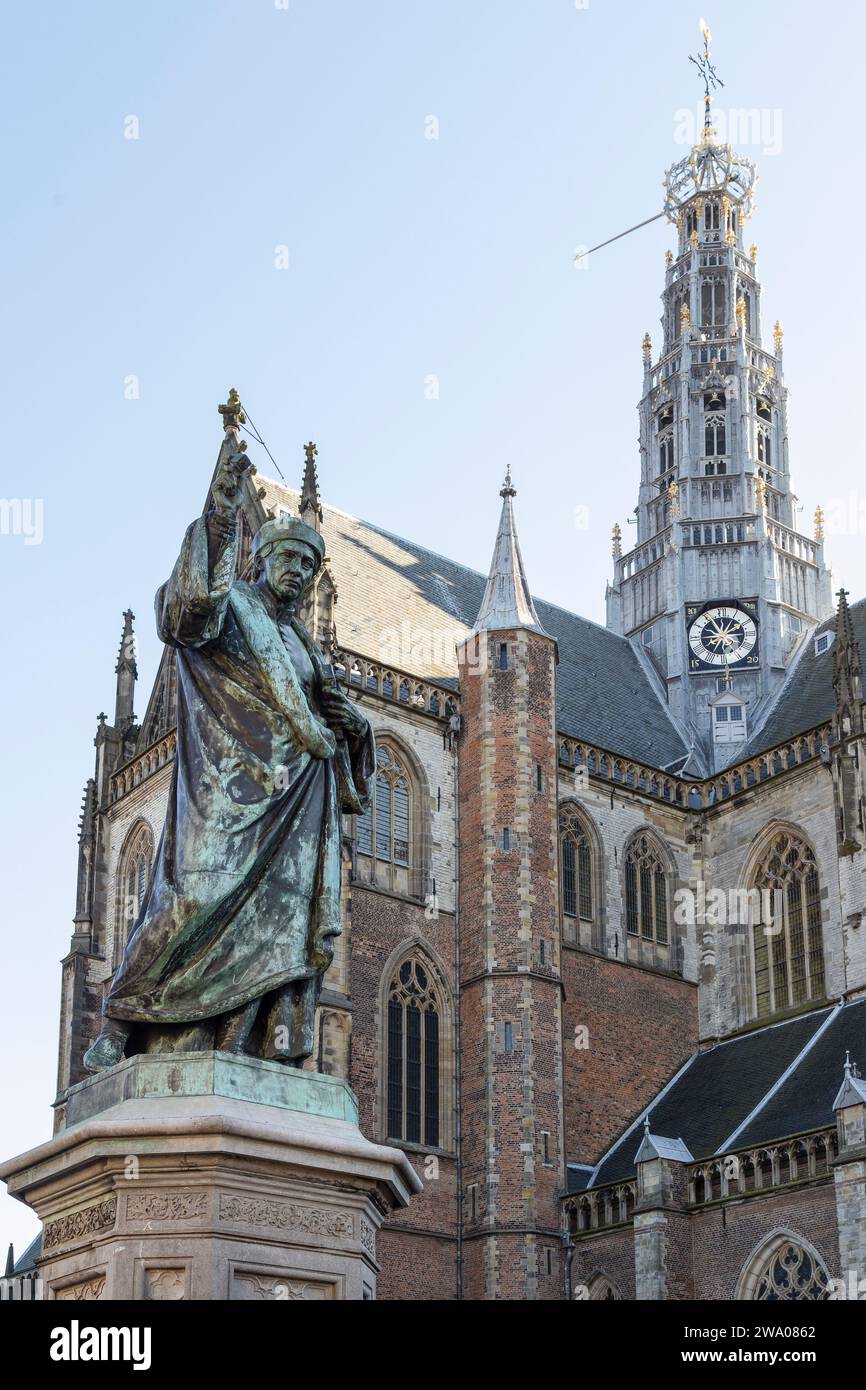Statue of Laurens Janszoon Coster with in the background the Grote Kerk - St. Bavokerk, in the city of Haarlem. Stock Photo