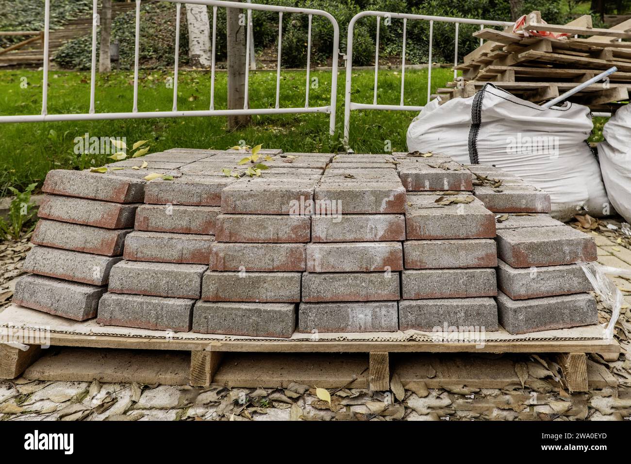 A pallet of paving stones to pave open streets in the middle of a garden Stock Photo