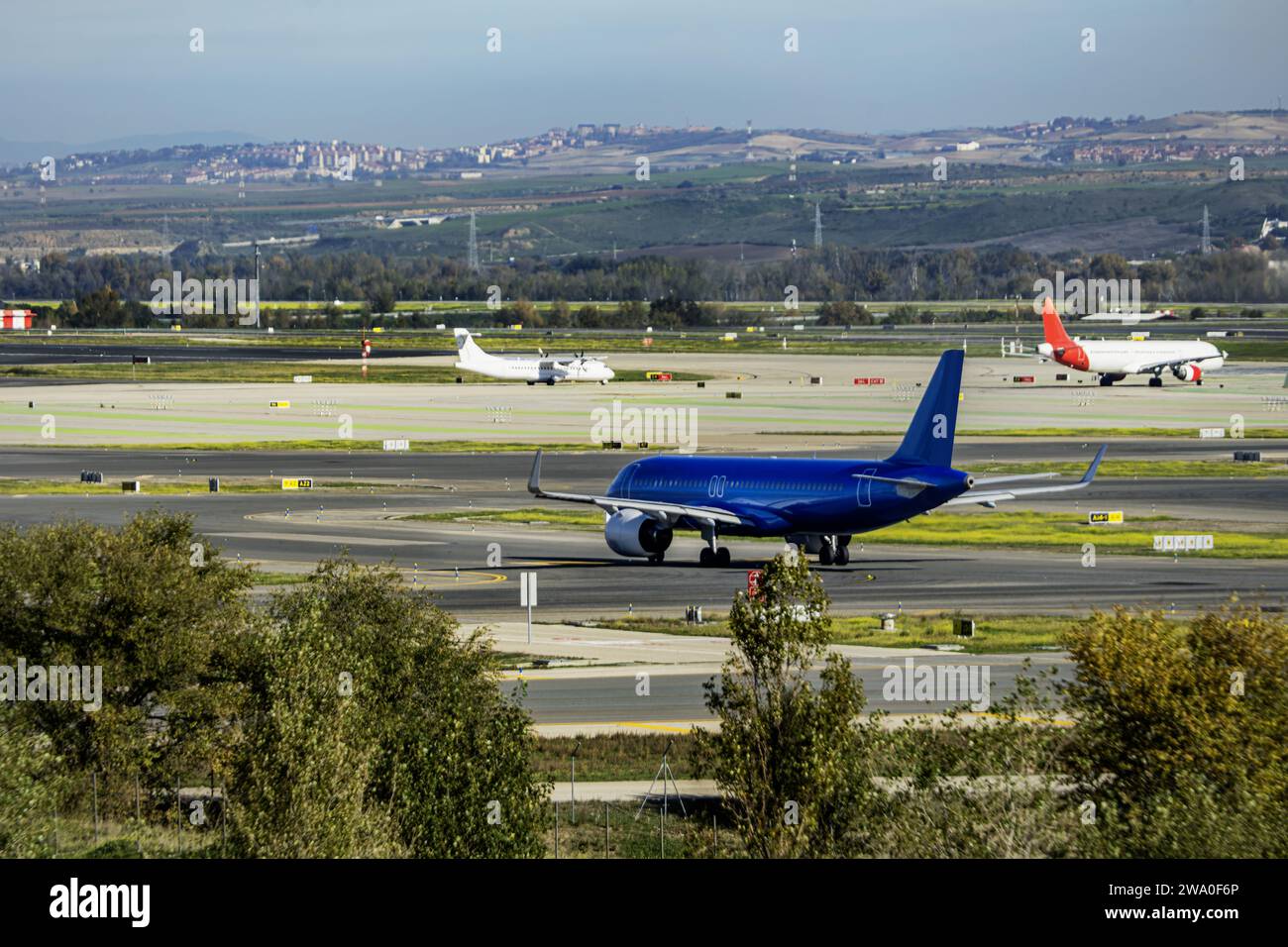 Passenger planes zigzagging along the runways heading for takeoff Stock Photo