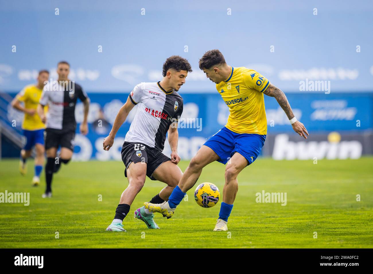 Belloumi of SC Farense (L) and Tiago Araujo of Estoril Praia (R) seen in action during the Liga Portugal Betclic match between Estoril Praia and SC Farense at Estadio Antonio Coimbra da Mota. Final score; Estoril Praia 4 : 0 SC Farense. Stock Photo