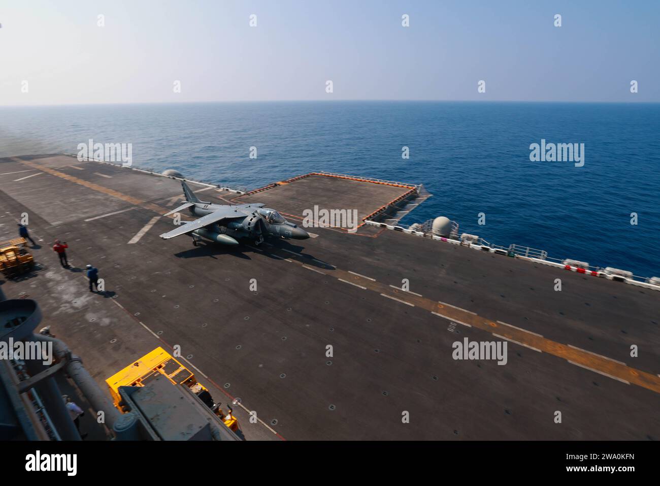 231023-N-OQ442-2020 GULF OF ADEN (Oct. 23, 2023) An AV-8B Harrier, attached to Marine Medium Tilt Rotor Squadron 126 (reinforced) launches off the Wasp-class amphibious assault ship USS Bataan (LHD 5) flight deck in the Gulf of Aden, Oct. 23. Components of the Bataan Amphibious Ready Group and 26th Marine Expeditionary Unit (Special Operations Capable) are deployed to the U.S. 5th Fleet area of operations to help ensure maritime security and stability in the Middle East region. (U.S. Navy photo by Mass Communication Specialist 3rd Class Riley Gasdia) Stock Photo