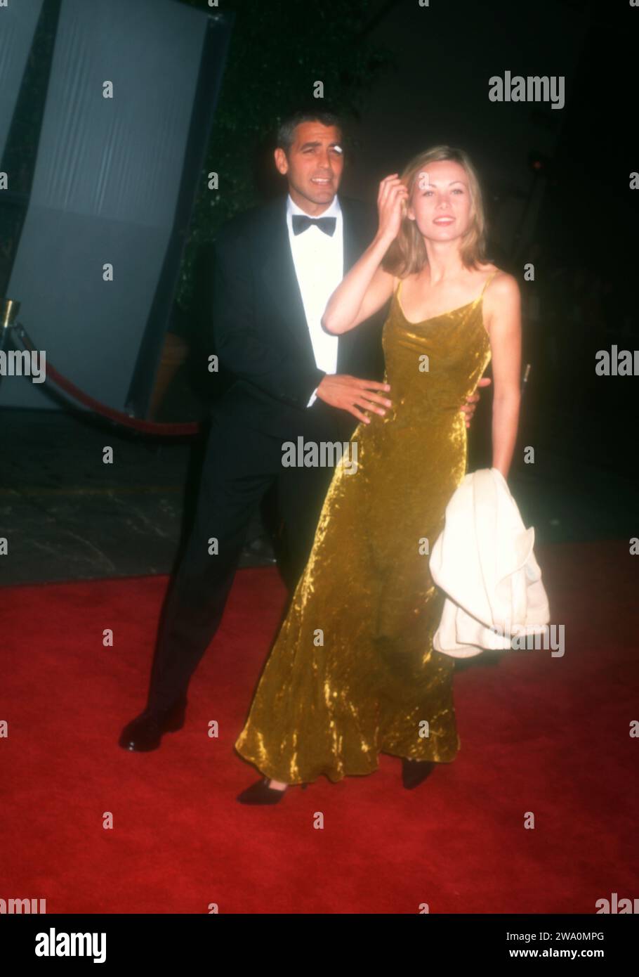 Burbank, California, USA 17th October 1996 Actor George Clooney and Celine Balitran attend Sixth Annual Fire & Ice Ball to Benefit Revlon/UCLA WomenÕs Cancer Research on October 17, 1996 at Warner Bros. Studios in Burbank, California, USA. Photo by Barry King/Alamy Stock Photo Stock Photo