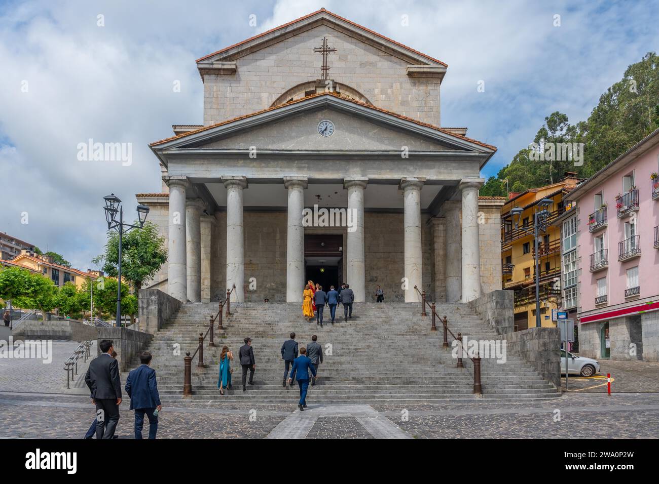 People entering the church of Our Lady of the Assumption in the coastal ...