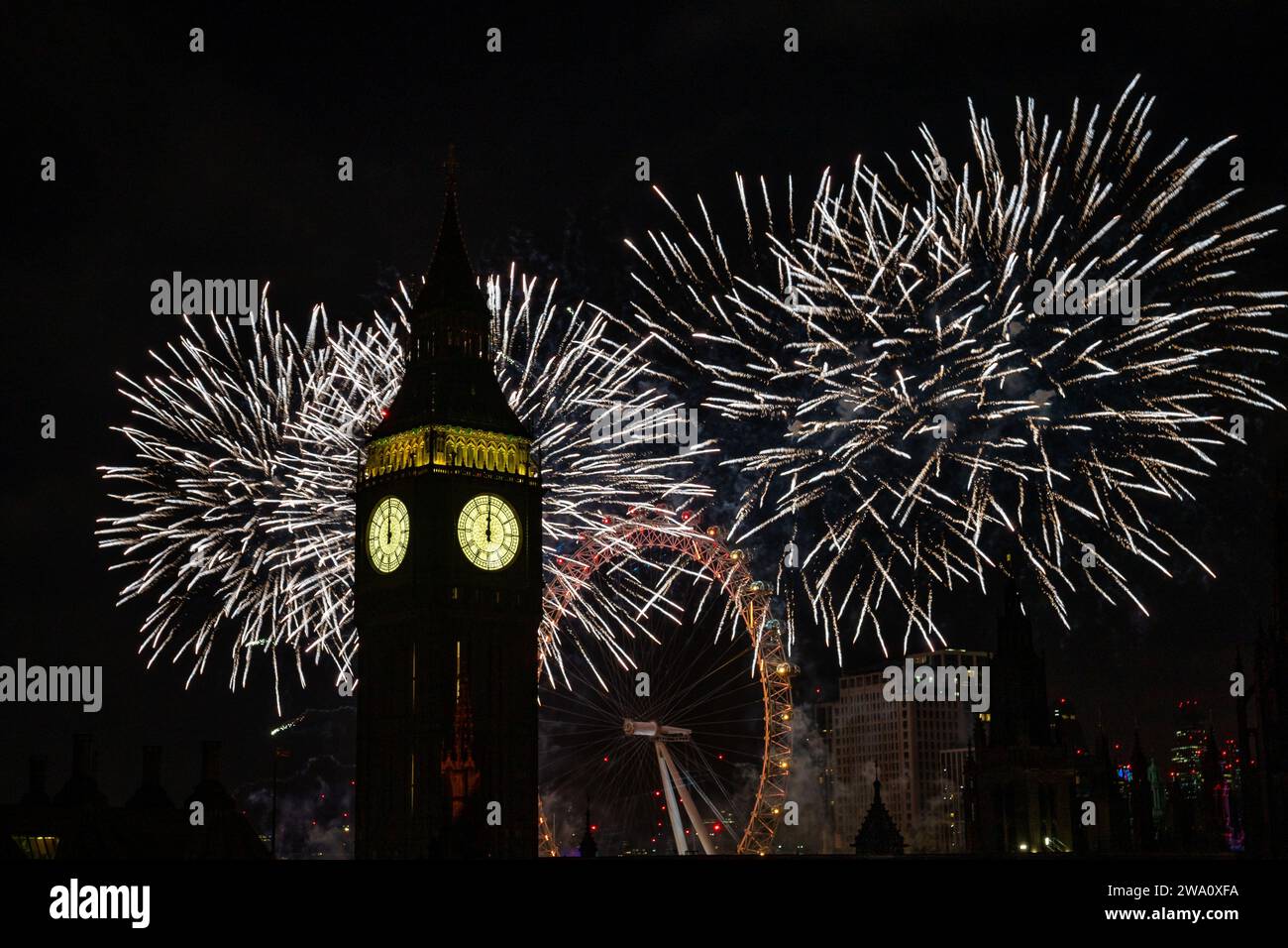 Fireworks light up the sky over the London Eye in central London during