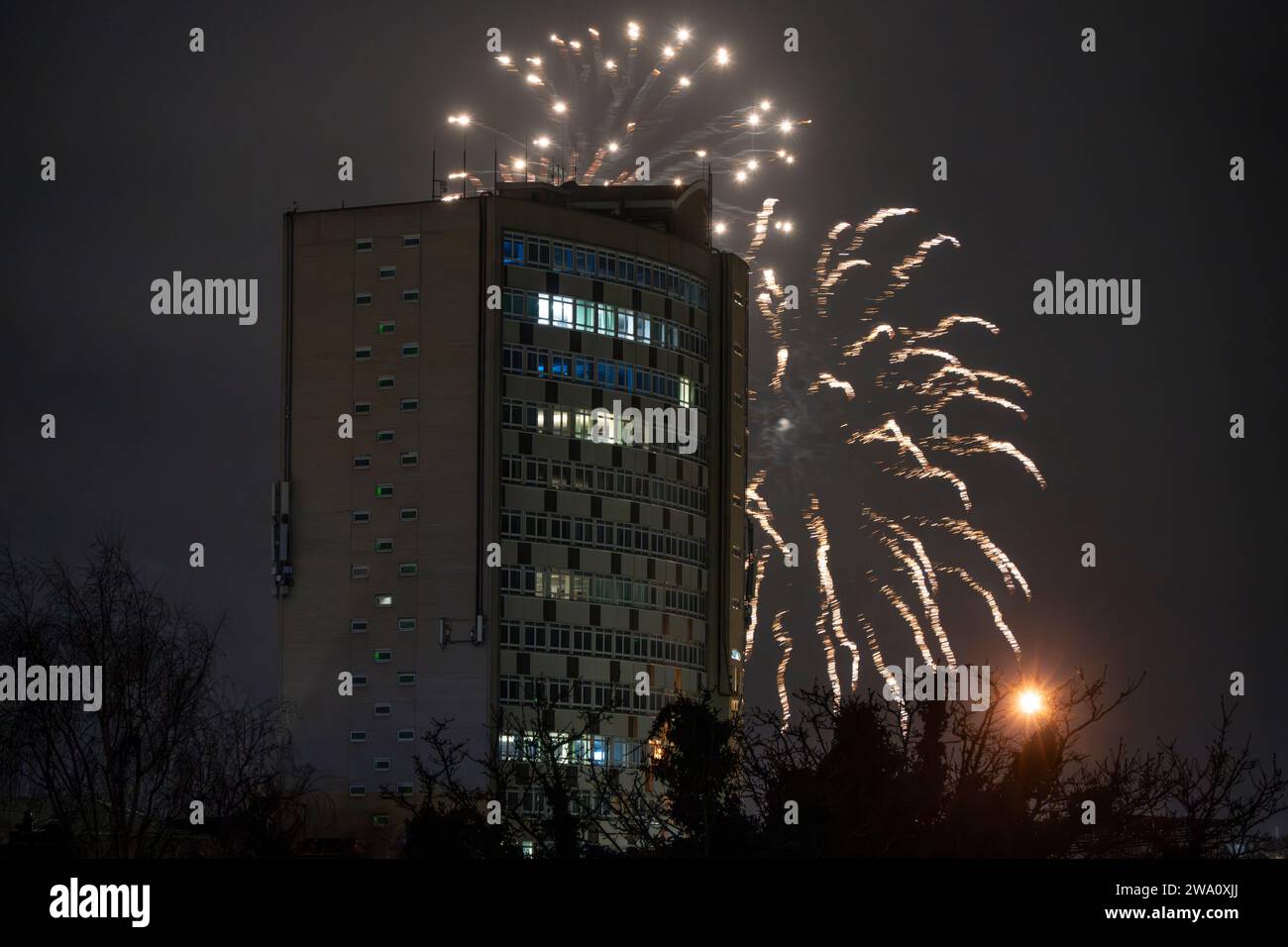 Merton, London, UK. 1st Jan, 2024. New Years Day fireworks burst around
