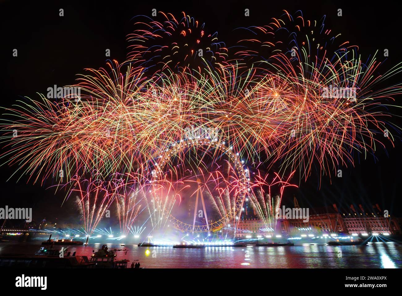 Fireworks light up the sky over the London Eye in central London during