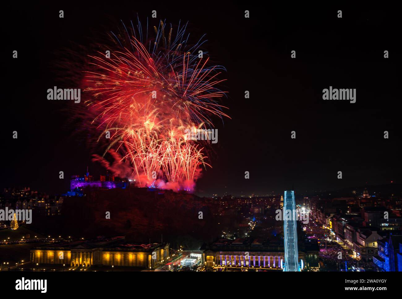 Edinburgh, Scotland, UK, 1st January 2024, Edinburgh Hogmanay fireworks: The New Year celebrations end 2023 with a 6.5 minute firework display from Edinburgh Castle by Titanium Fireworks with 50,000 revellers thronging the street party below. Credit Sally Anderson/Alamy Live News Stock Photo