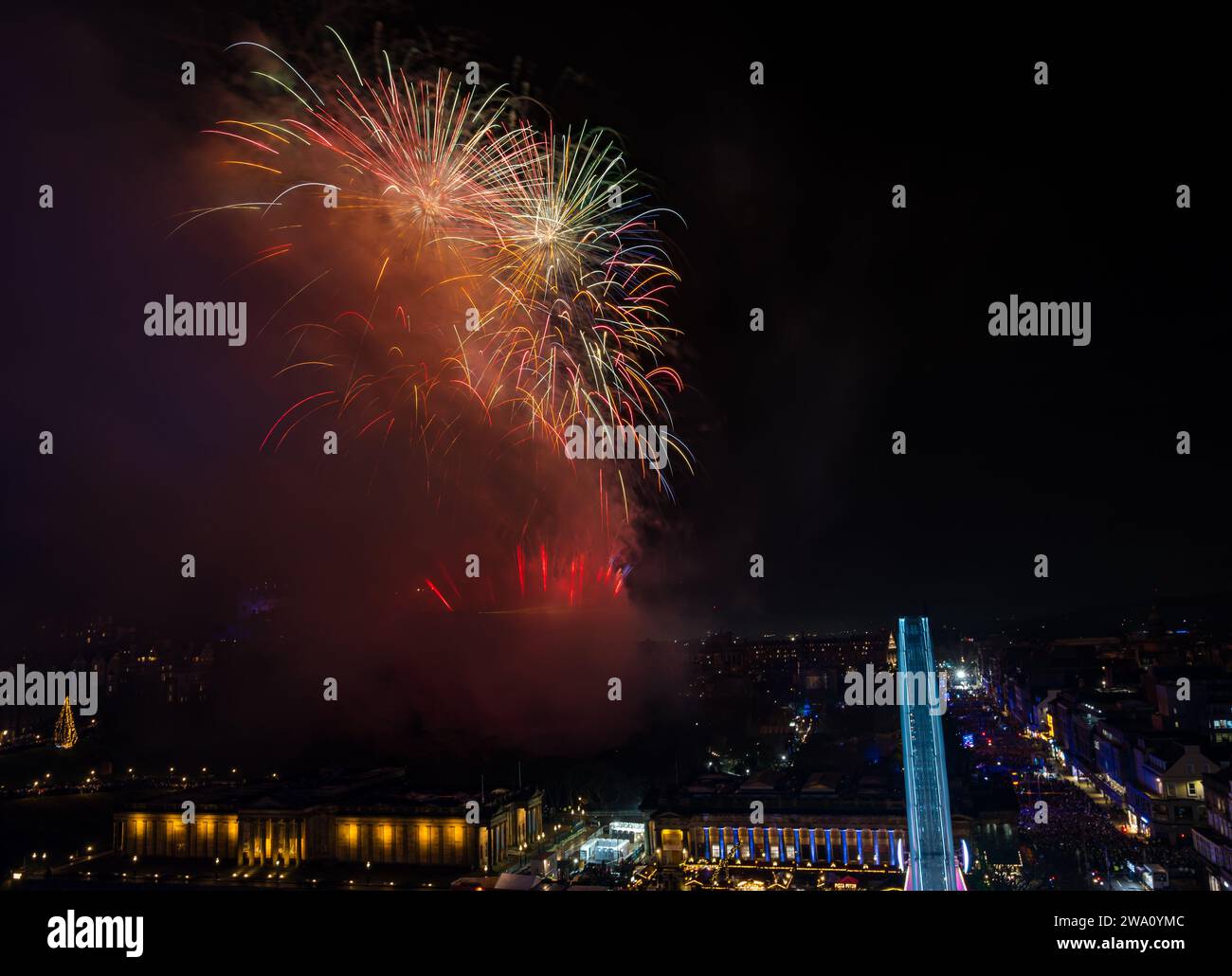 Edinburgh, Scotland, UK, 1st January 2024, Edinburgh Hogmanay fireworks: The New Year celebrations end 2023 with a 6.5 minute firework display from Edinburgh Castle by Titanium Fireworks with 50,000 revellers thronging the street party below. Credit Sally Anderson/Alamy Live News Stock Photo