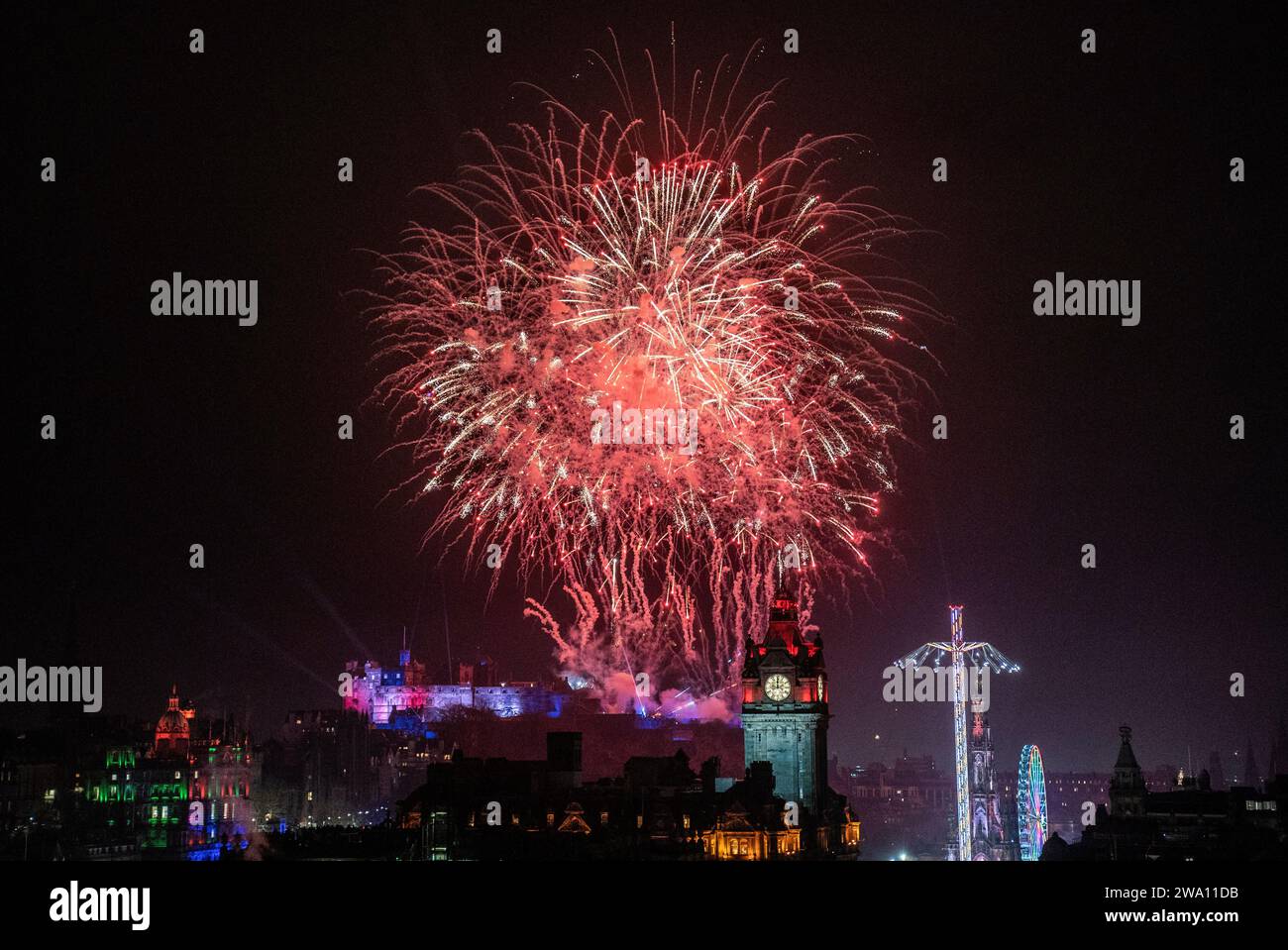 Fireworks explode over Edinburgh Castle and the Balmoral Clock during