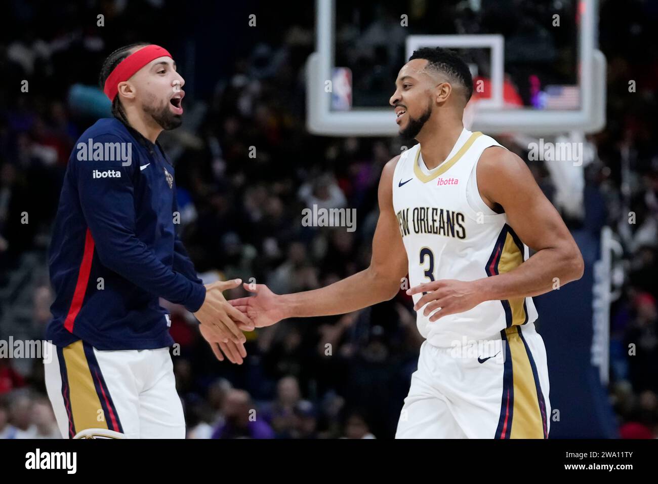 New Orleans Pelicans guard CJ McCollum (3) is greeted by guard Jose ...