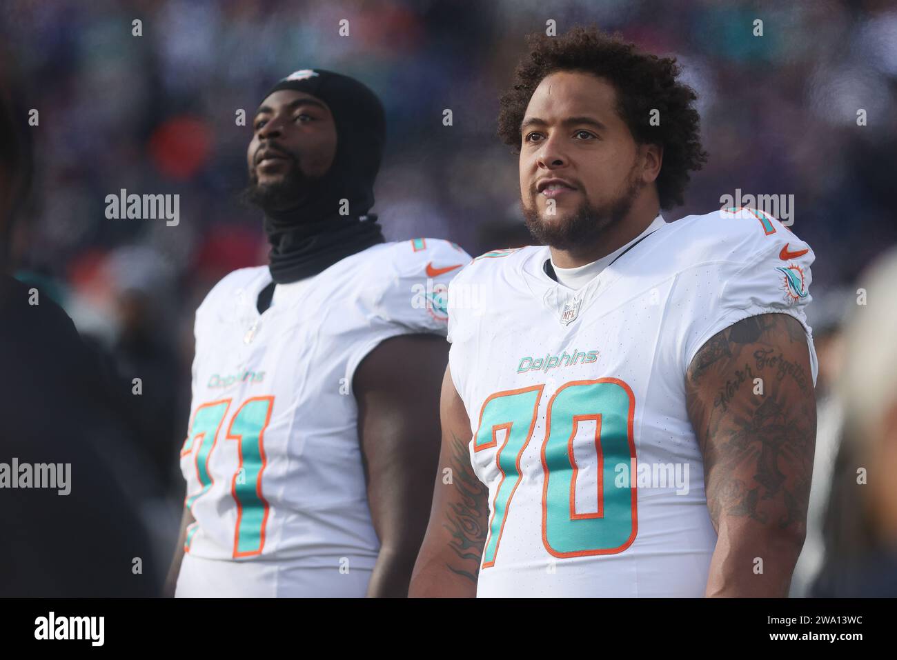 Baltimore, MD, USA. 31st Dec, 2023. Miami Dolphins T Kendall Lamm (70) and Miami Dolphins T Kion Smith (71) pictured on the sidelines during a game against the Baltimore Ravens at M&T Bank Stadium in Baltimore, MD. Photo/ Mike Buscher/Cal Sport Media (Credit Image: © Mike Buscher/Cal Sport Media/Cal Sport Media). Credit: csm/Alamy Live News Stock Photo