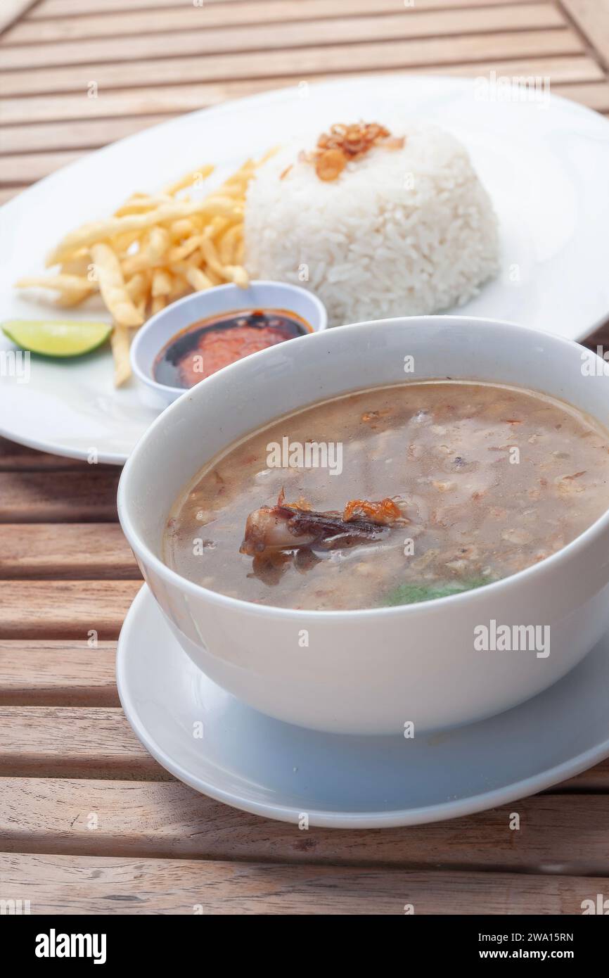 Nasi Sup Buntut made from a soup containing soft cooked beef tail bones and served with rice Stock Photo
