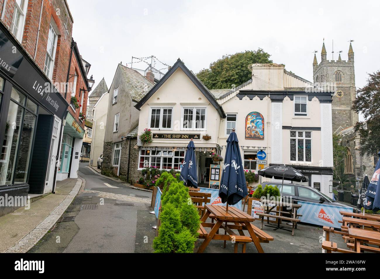 Fowey in Cornwall England, and the Ship Inn public house built in 1435 which sells ales and Cornish lager Korev, England,UK,2023 Stock Photo