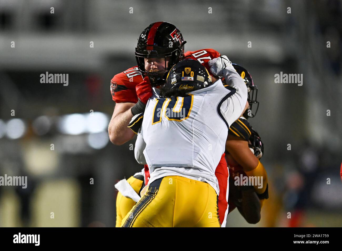 Shreveport, LA, USA. 16th Dec, 2023. Texas Tech offensive lineman Cole Spencer (70) and California linebacker Sergio Allen (10) clash during the Radiance Technologies Independence Bowl between the Texas Tech Red Raiders and the California Bears, at Independence Stadium in Shreveport, LA. Kevin Langley/CSM/Alamy Live News Stock Photo