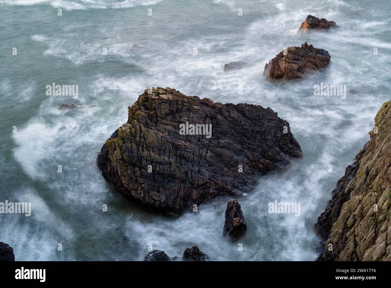 Coastal rocks and sea in the wind. Portknockie, Morayshire, Scotland. long exposure Stock Photo